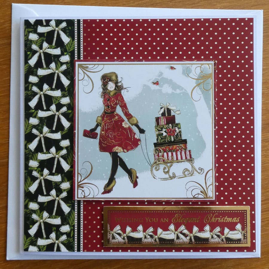 Christmas Card - Girl With Presents on a Sleigh