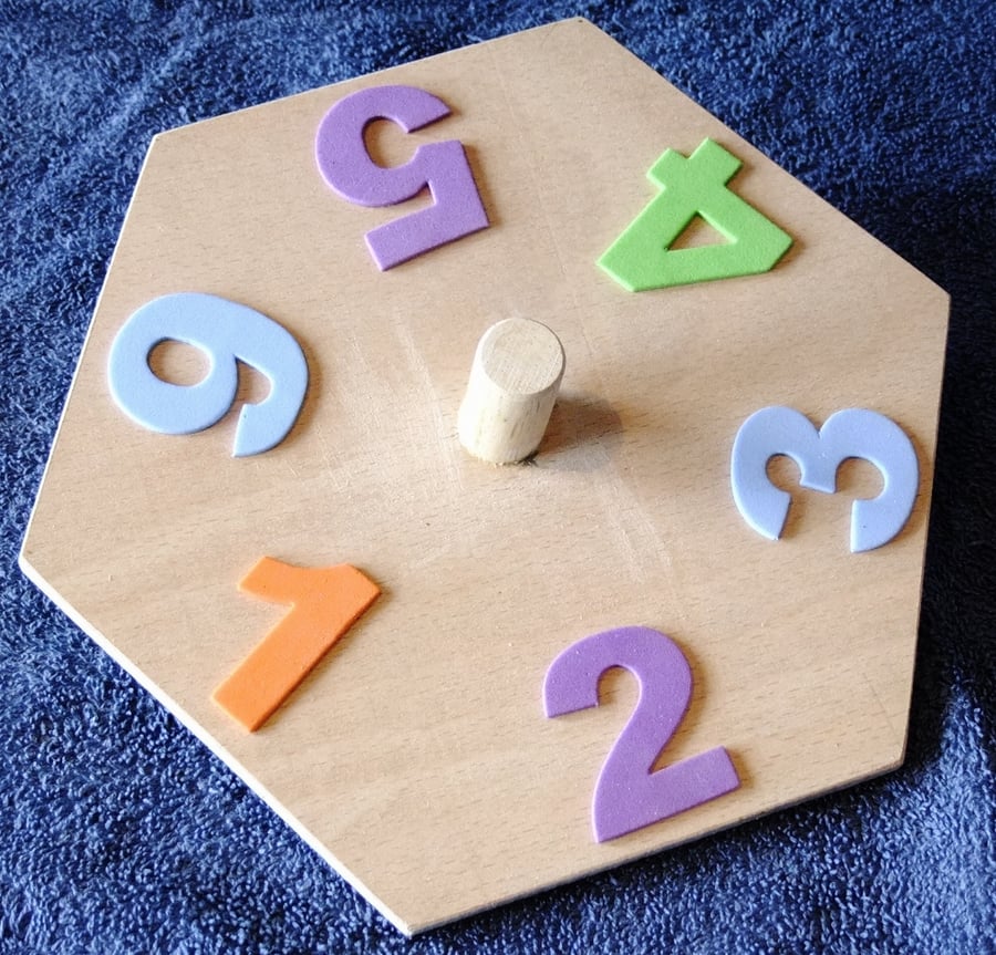 Child's six sided spinning top with foam crafting numbers, fun for counting.