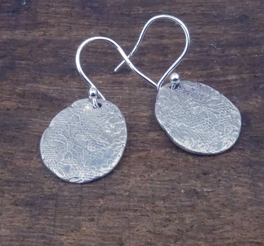 Silver earrings, lace textured