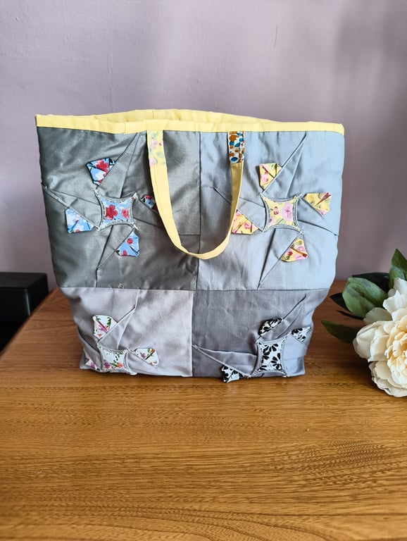 Grey and lemon tote bag with bright patchwork quilted lining.