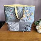 Grey and lemon tote bag with bright patchwork quilted lining.