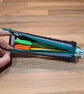 Pencil case - see-through with red, green, navy edge, green zip, yellow charm - Image 4