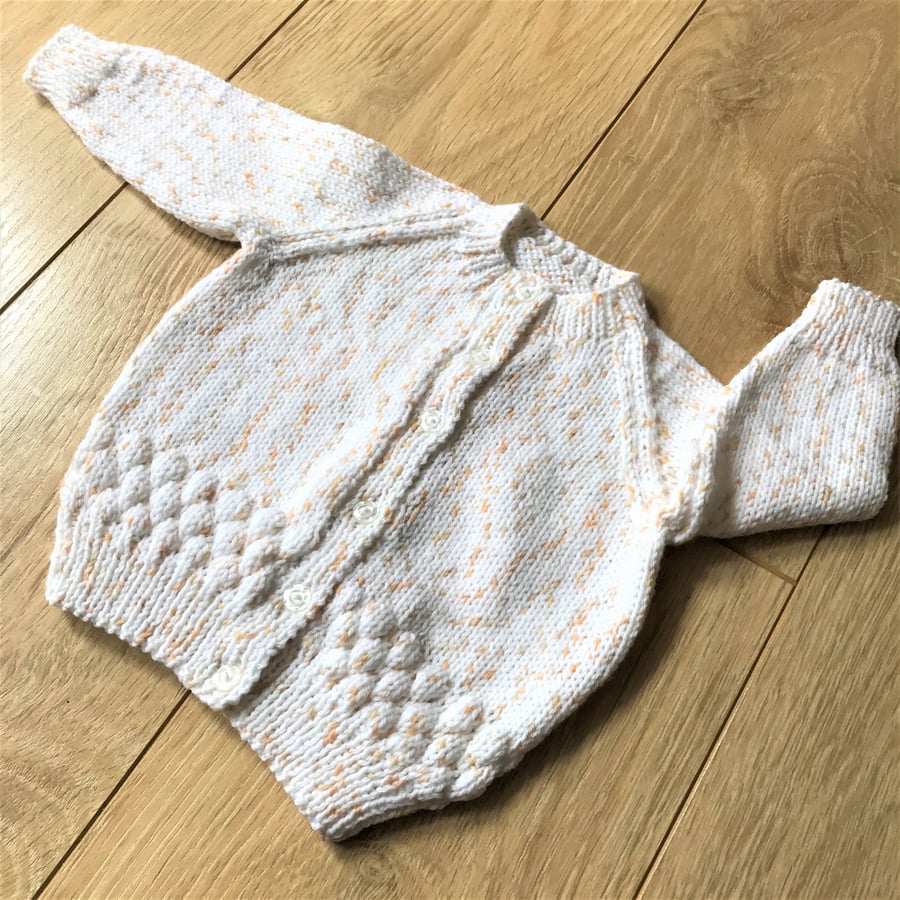 Hand knitted baby girl's cardigan to fit up to 12 months