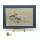 Hand embroidered picture of two curlews