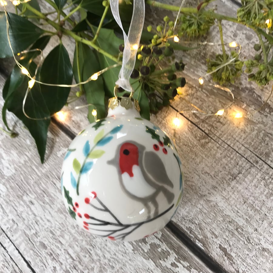 Hand painted robin on branch bauble