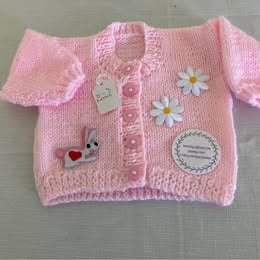Baby girl cardigan with attachments