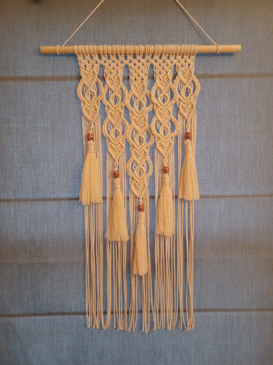 Handmade macrame wall hanging with a romantic heart design