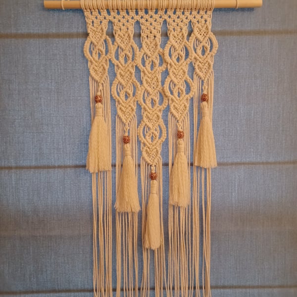 Handmade macrame wall hanging with a romantic heart design
