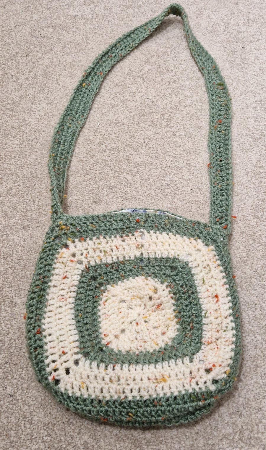 handmade crocheted crossbody bag with flower design