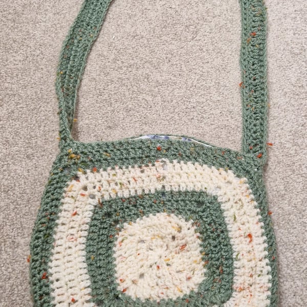 handmade crocheted crossbody bag with flower design