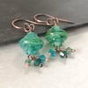 Green glass lamp work bead and Swarovski crystal earrings with copper ear wires 