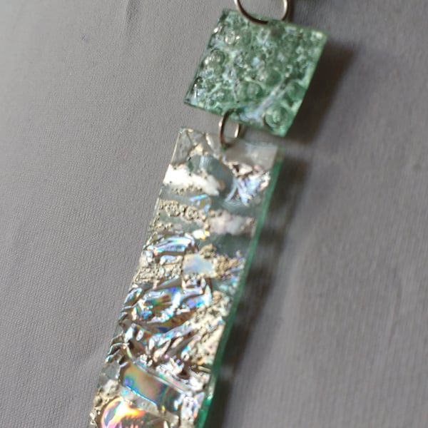 Two piece pendant. Silver and pale metallic green