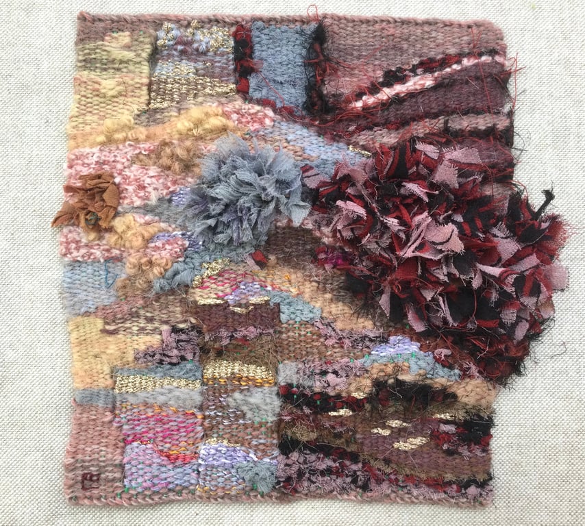 Unframed handwoven tapestry weaving, in pink, grey, peach, red and black