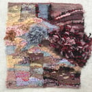 Unframed handwoven tapestry weaving, in pink, grey, peach, red and black