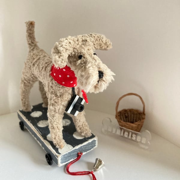 Scruffy Dog on a Wooden Trolley with Wheels 