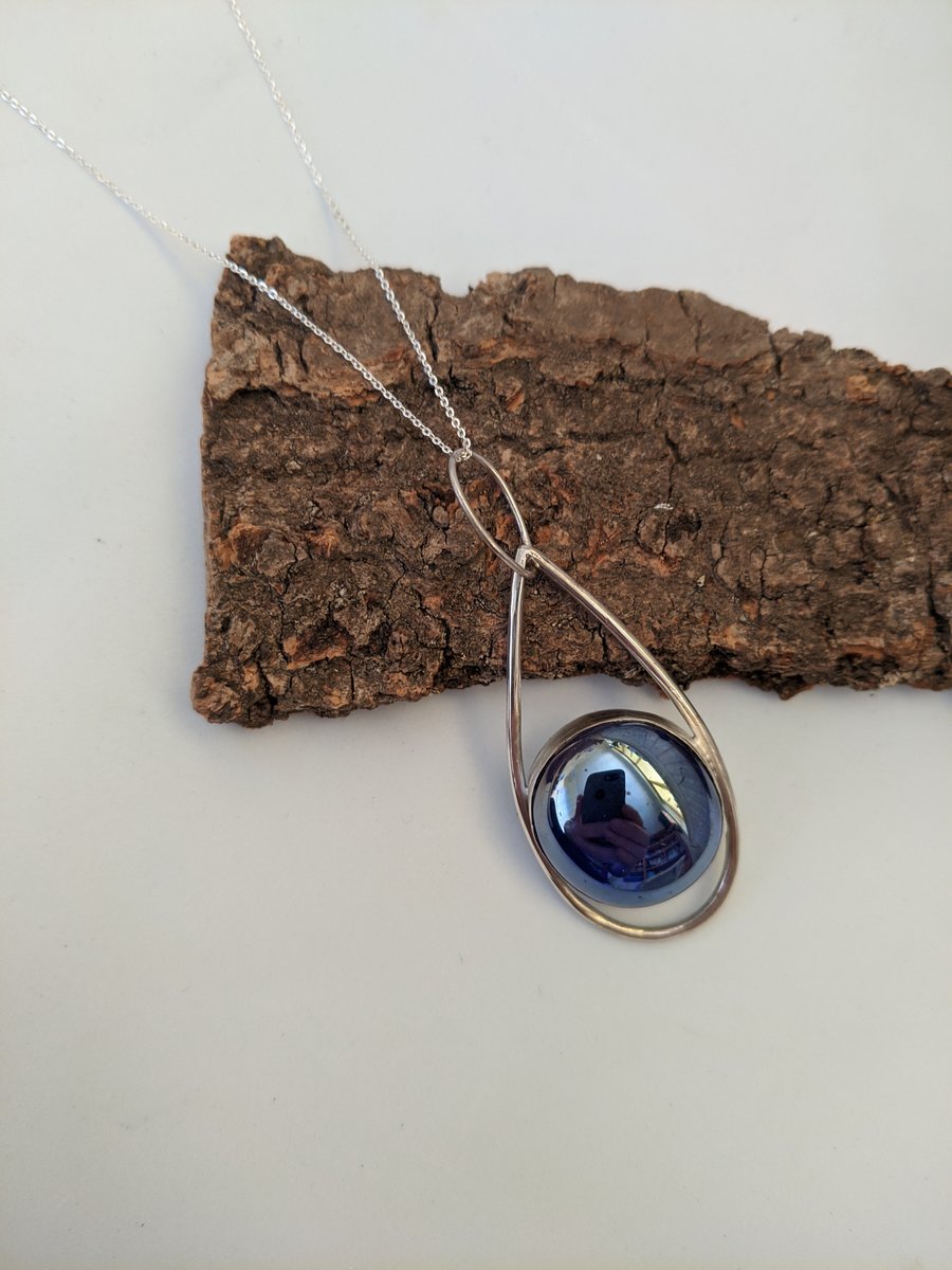 Beautiful blue fused glass and sterling silver pendant with a silver chain