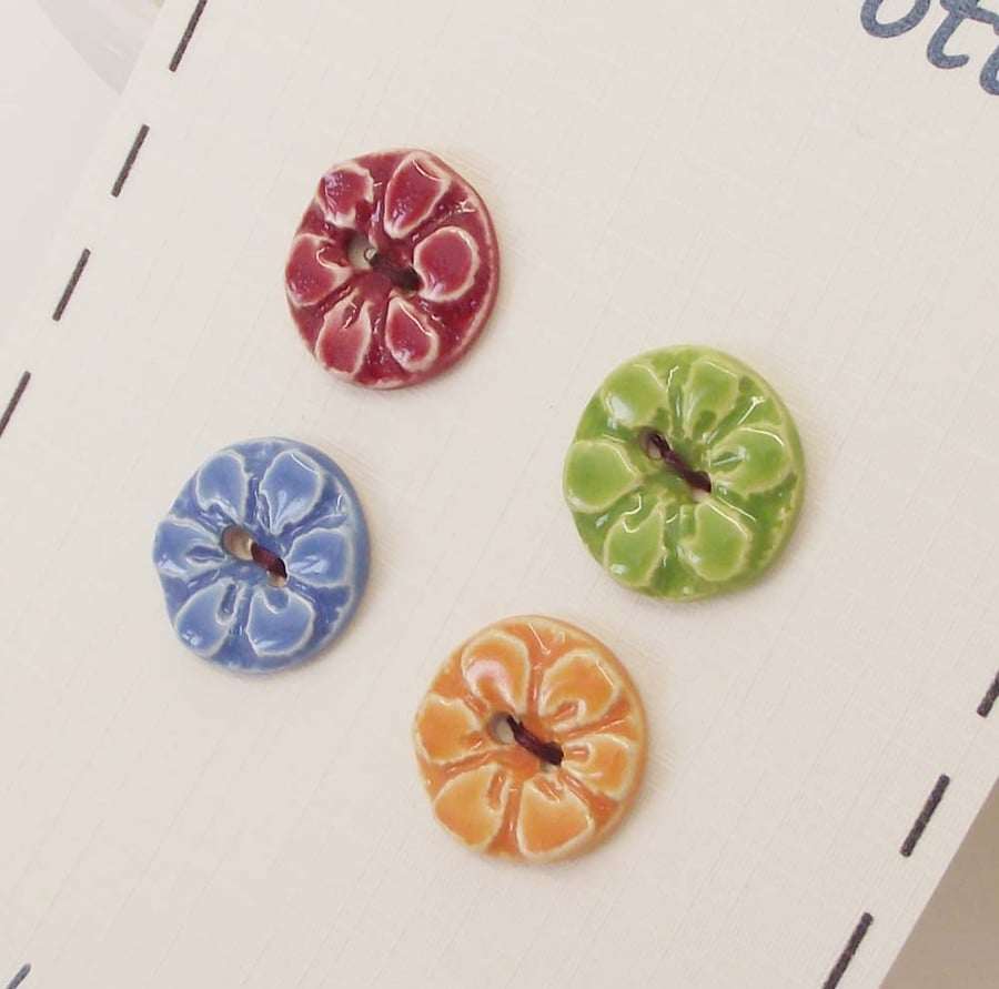 Set of four little handmade ceramic buttons