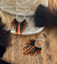 Halloween fringe hoop earrings in orange and black