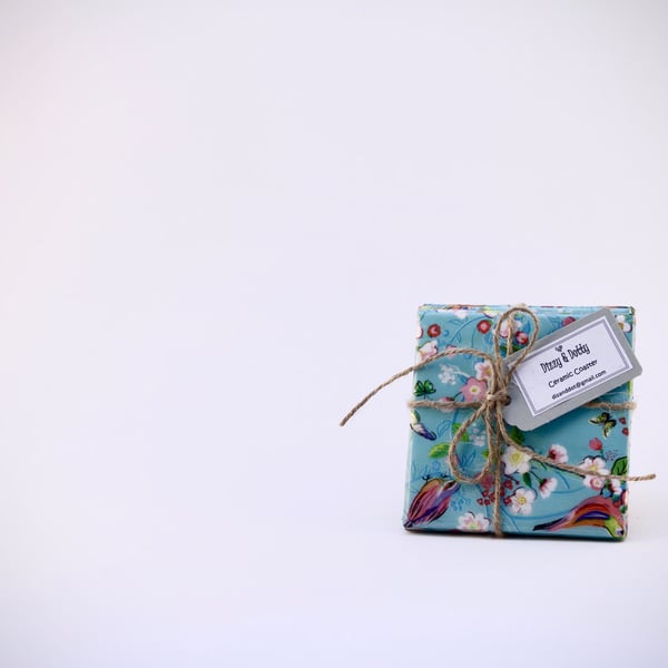A Set of Four 10 by 10 cm High Gloss Ceramic Tile Coasters .