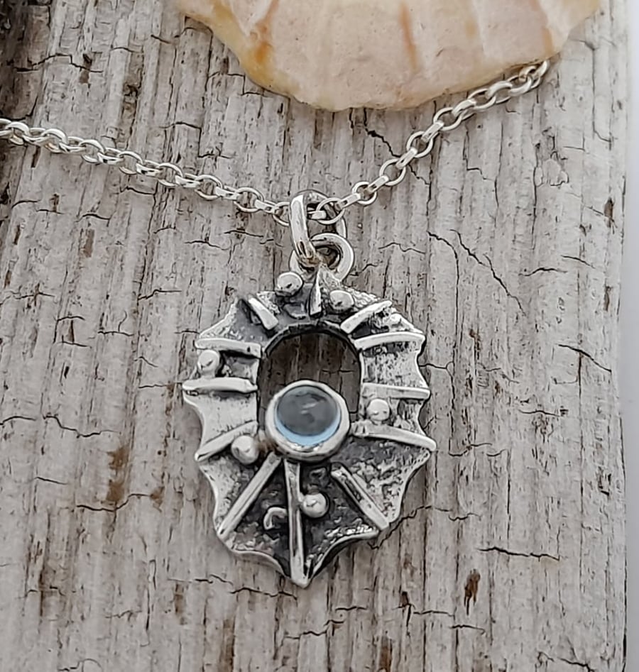 Sterling Silver Limpet Shell- One of a kind piece with a Blue Topaz