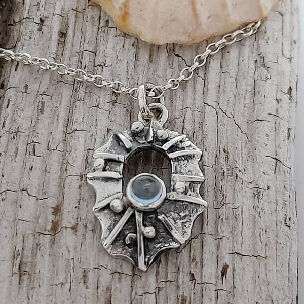 Sterling Silver Limpet Shell- One of a kind piece with a Blue Topaz