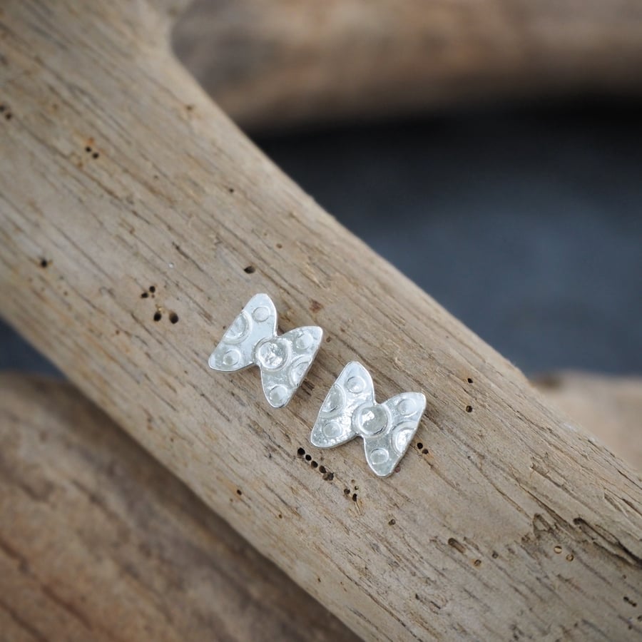 Small silver bowtie earring studs