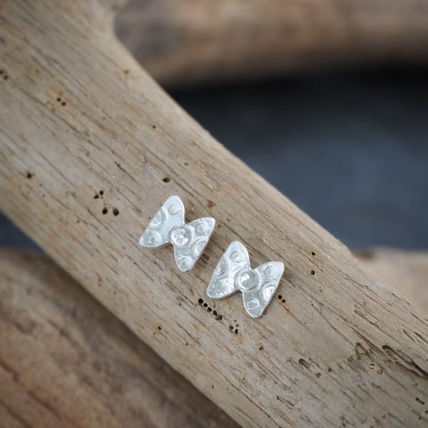 Small silver bowtie earring studs