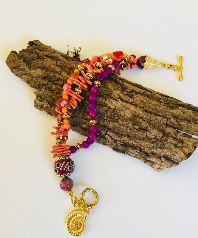 Three stranded semiprecious stone red and purple bracelet 