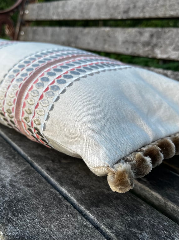 Long embroidered linen cushion cover with pompoms