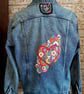 `Hand embroidered denim jacket, with red heart floral design