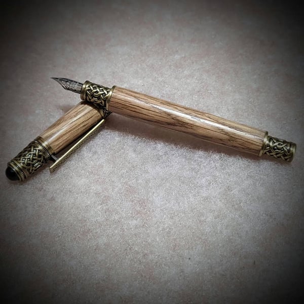 Handmade wooden fountain pen made from reclaimed Penderyn whisky barrel oak.