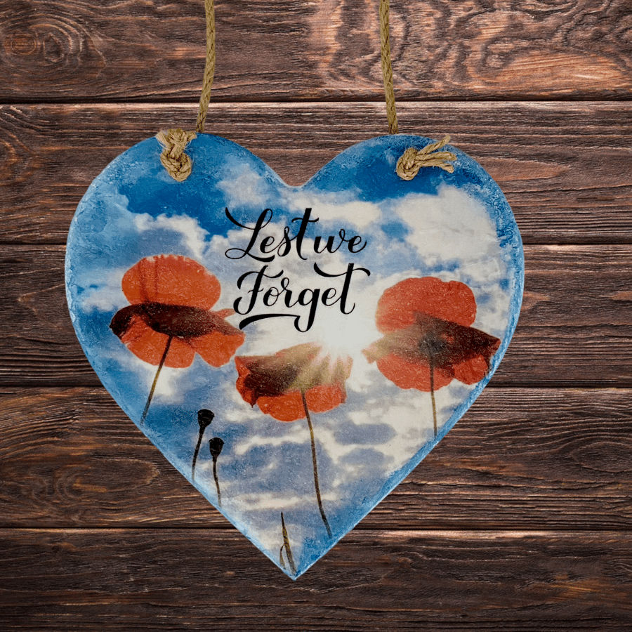 Lest we forget, handing wooden heart, Remembrance day