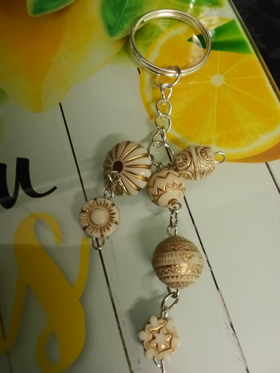 Pretty beaded 3 strand keyring, silver , nicely detailed beads. 