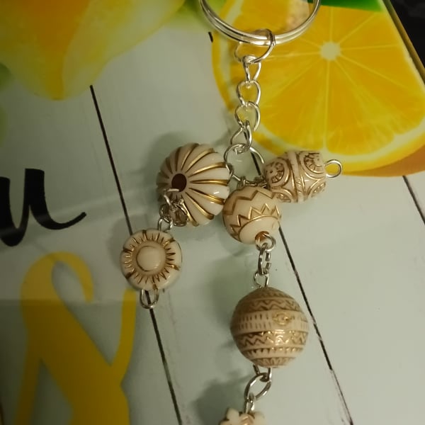 Pretty beaded 3 strand keyring, silver , nicely detailed beads. 