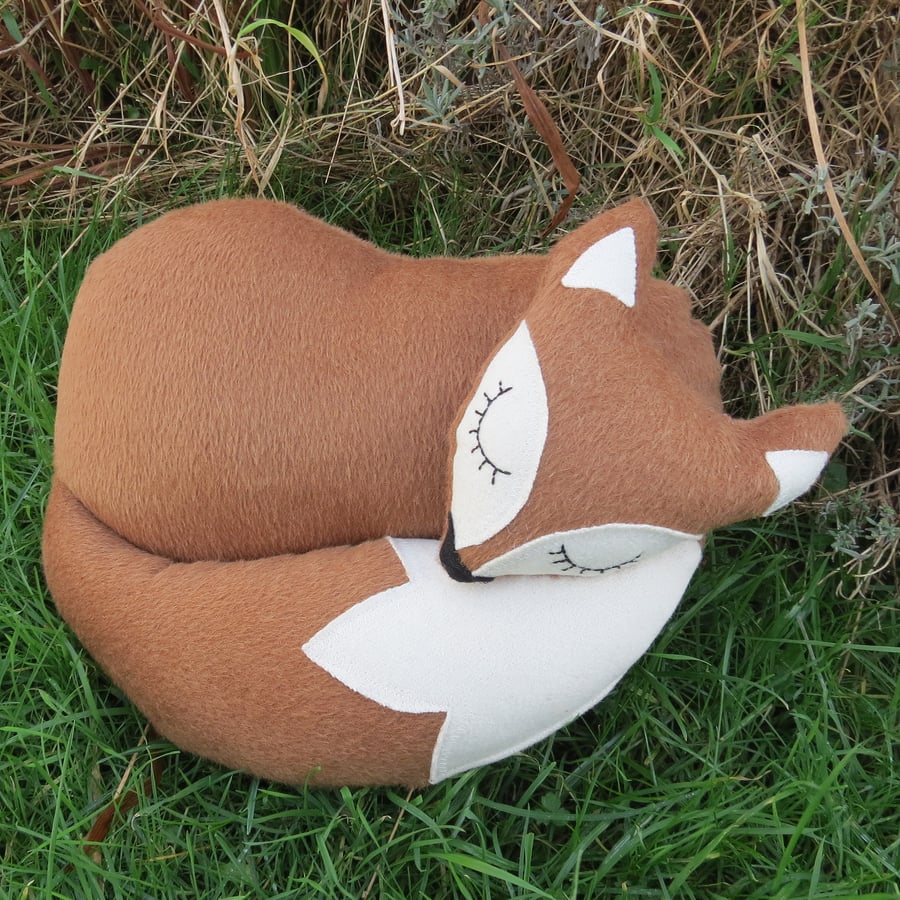 Brown fox.  A snoozy fox cushion made from textured wool.  38cm in length.
