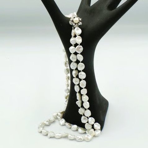 Natural pearl necklace with a silver crystal clasp  Traditionally knotted silk