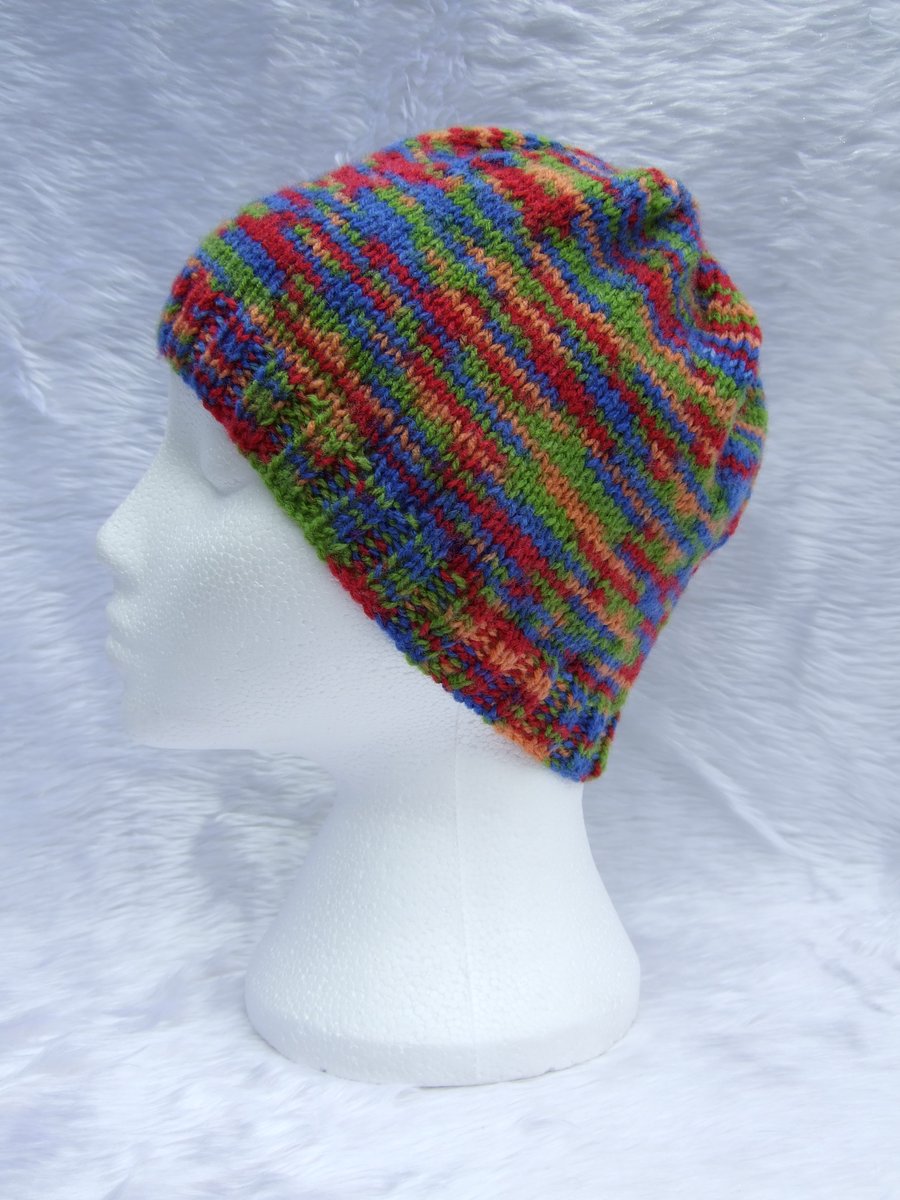 Hand knitted beanie hat in multicolour yarn red blue for children or teenagers
