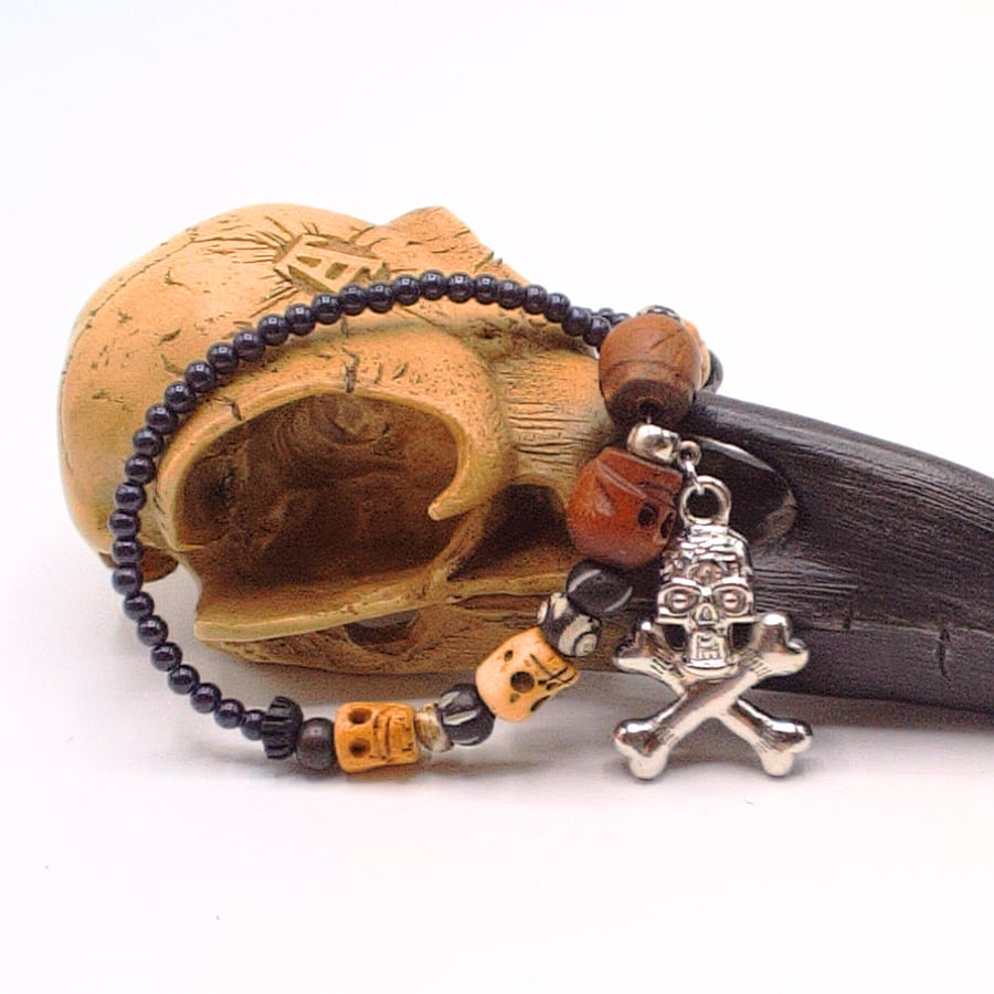 Skull & Crossbones Pendant on a Purple Bead and Skull Bead Necklace, Halloween