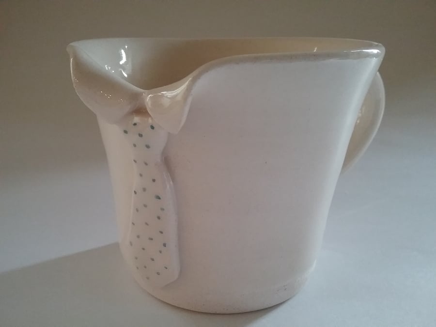 Individual hand-thrown ceramic pottery mug or cup with tie detail.