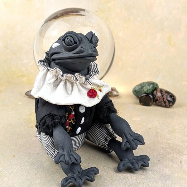 'Rospo’, a porcelain and textile frog doll.