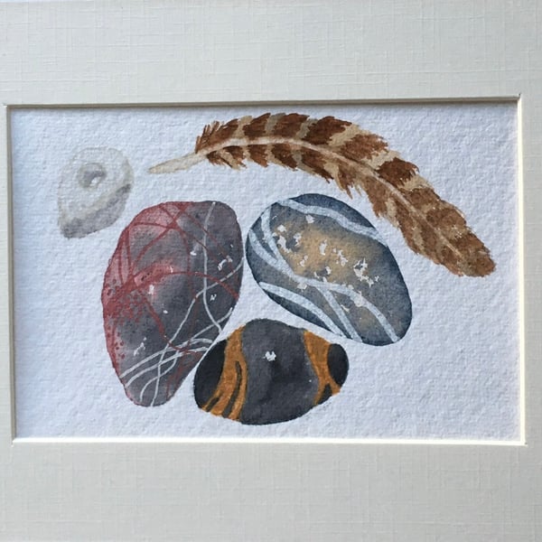 Chalk hagstone and feather artwork 