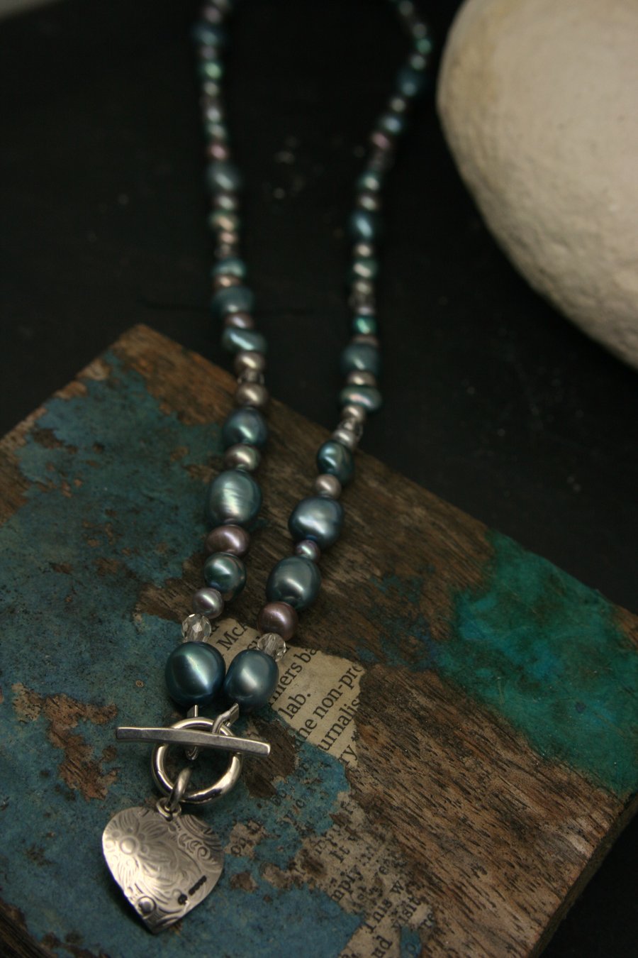 Heart pendant on pearl necklace
