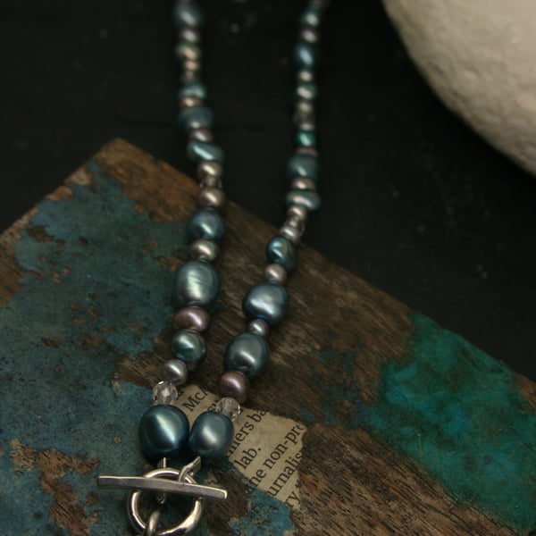 Heart pendant on pearl necklace