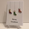 Merry Christmas card with Christmas stocking buttons