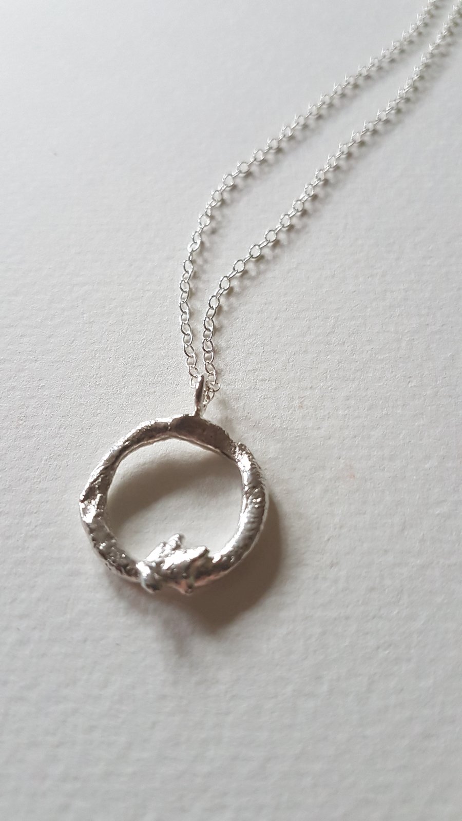 Molten silver organic circle necklace