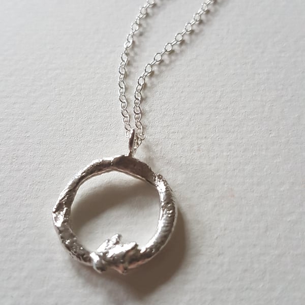 Molten silver organic circle necklace