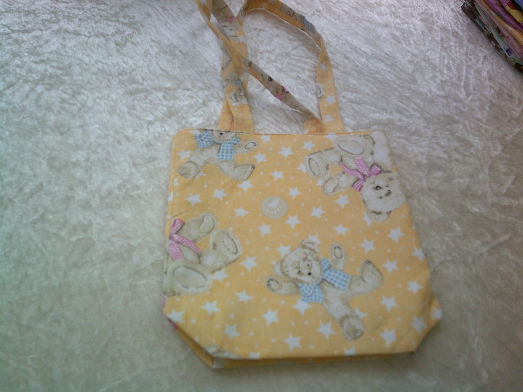 Teddy Bears in Bows and Stars on a yellow Background