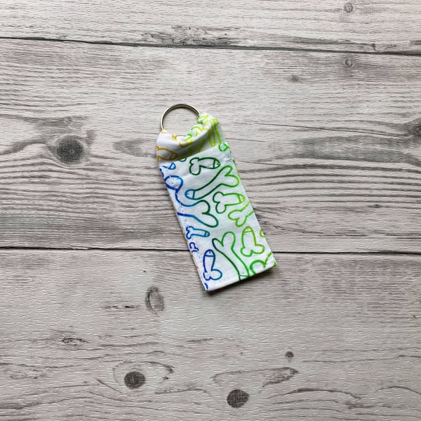 Fun willy print themed fun lip balm cotton fabric keyring. 