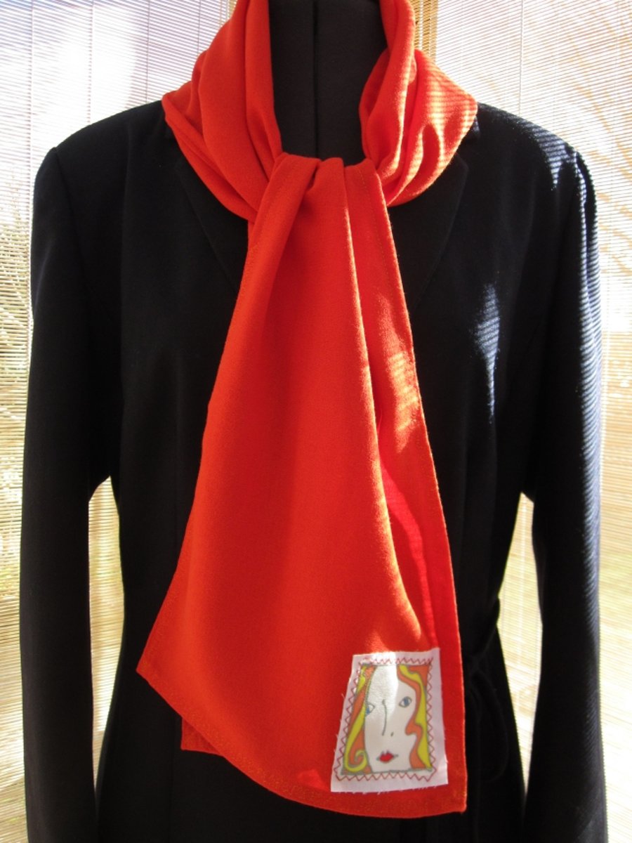 Orange, fabric scarf with decorative  hand panted panel.