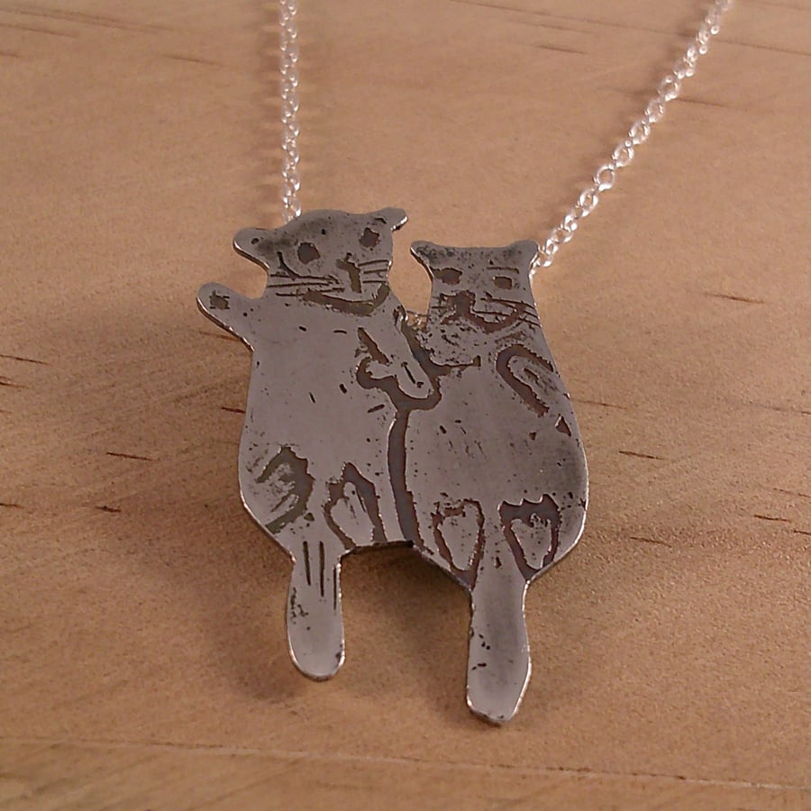 Sterling Silver Pair of Otters Holding Hands Necklace (SKU070325)